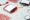 Bags and test tubes with donor blood on white background, close up