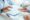 Doctor or physician writing a diagnosis and giving a medical prescription to a male patient