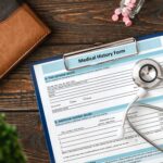 Patient medical history on a clipboard with stethoscope