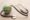 selective focus of stethoscope and toy earth on wooden and white table