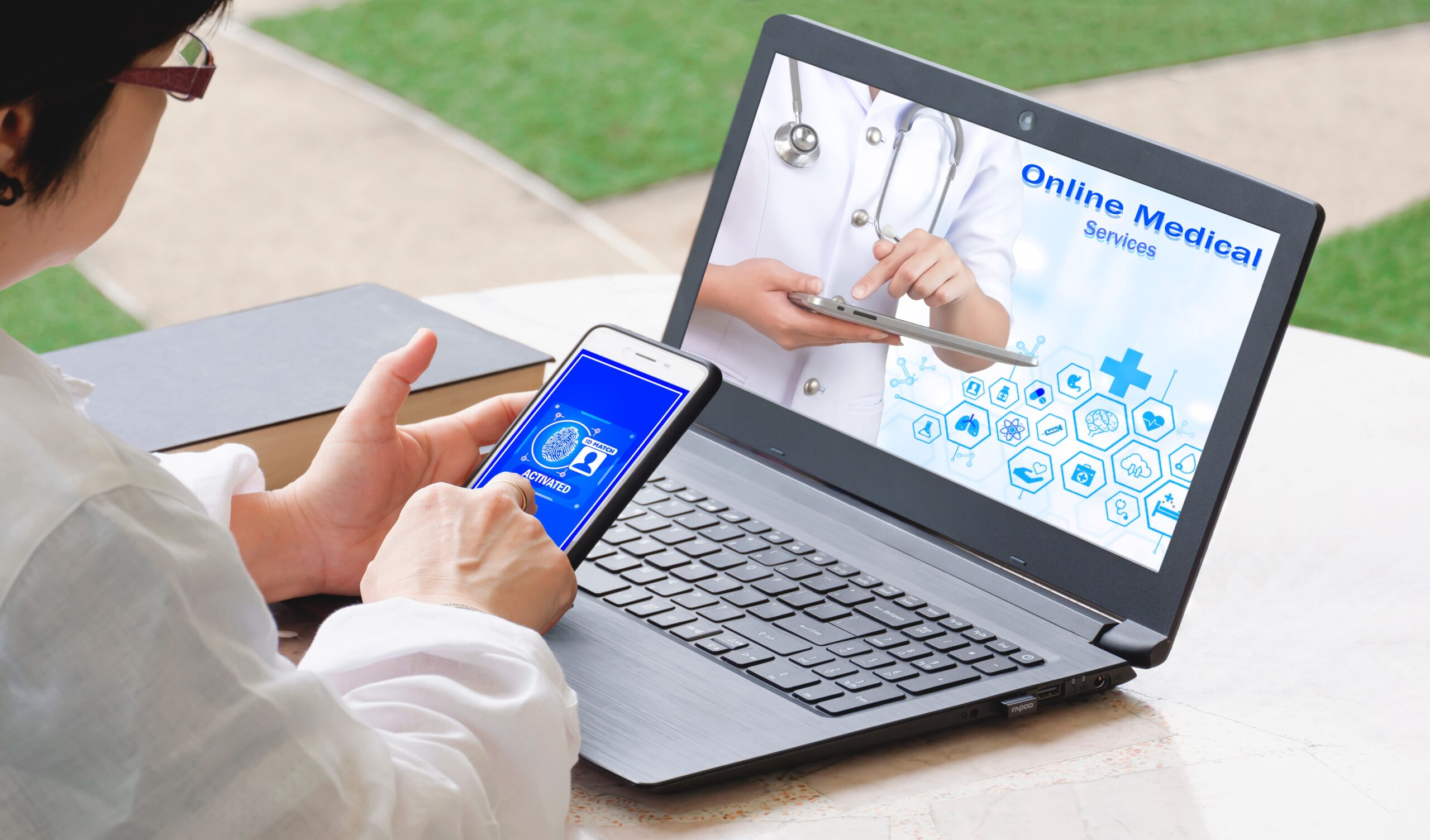 woman using smartphone to scan fingerprint to access online medical healthcare service