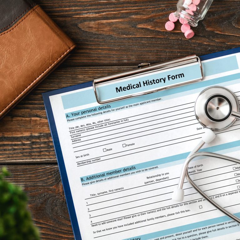 Patient medical history on a clipboard with stethoscope